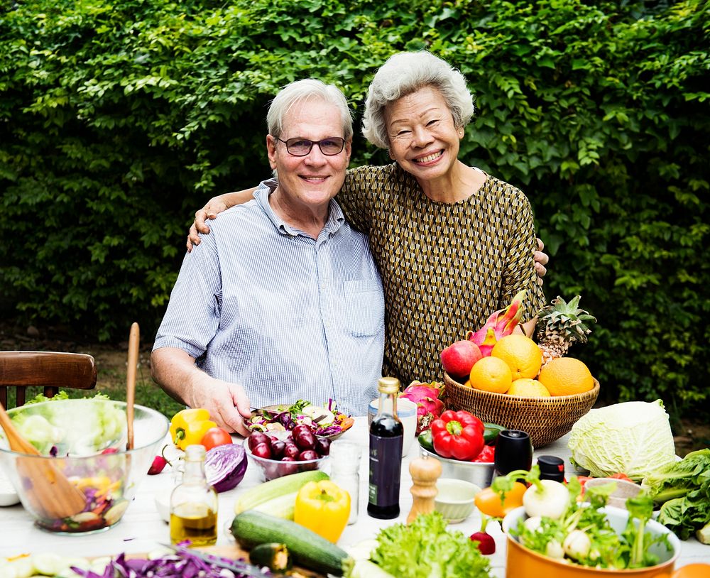 Senior couple with fresh vegetable outdoors