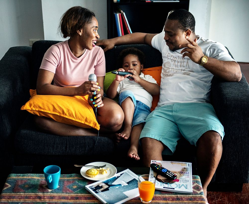 Black family enjoy singing karaoke