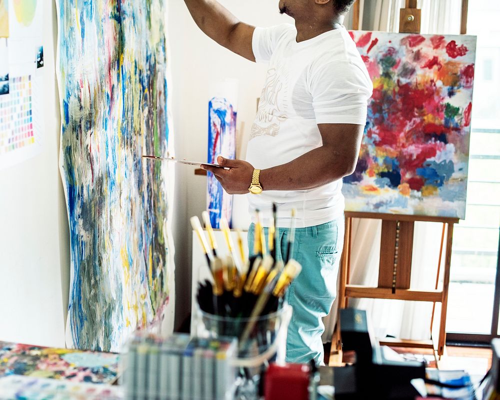Black artist man doing artwork
