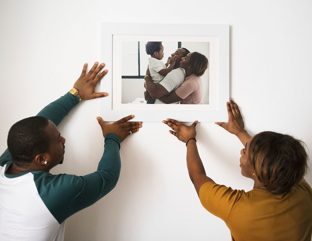 Black couple hanging fmily photo