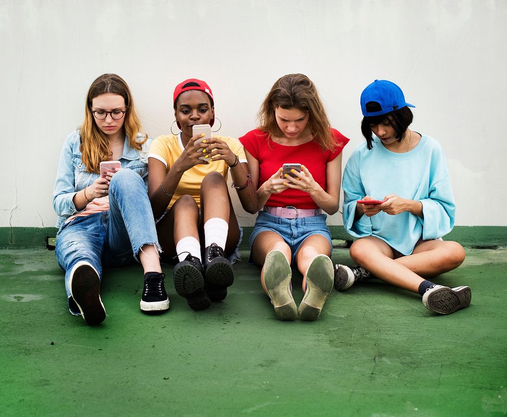 Group of diverse women with mobile phone