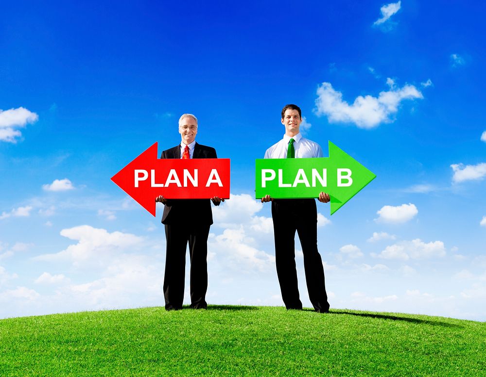 Two Businessmen Holding Contrasting Arrows for Plan A and Plan B