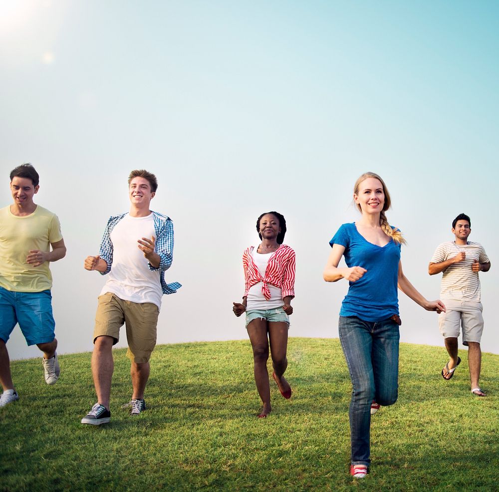 Group Casual People Running Outdoors Concept
