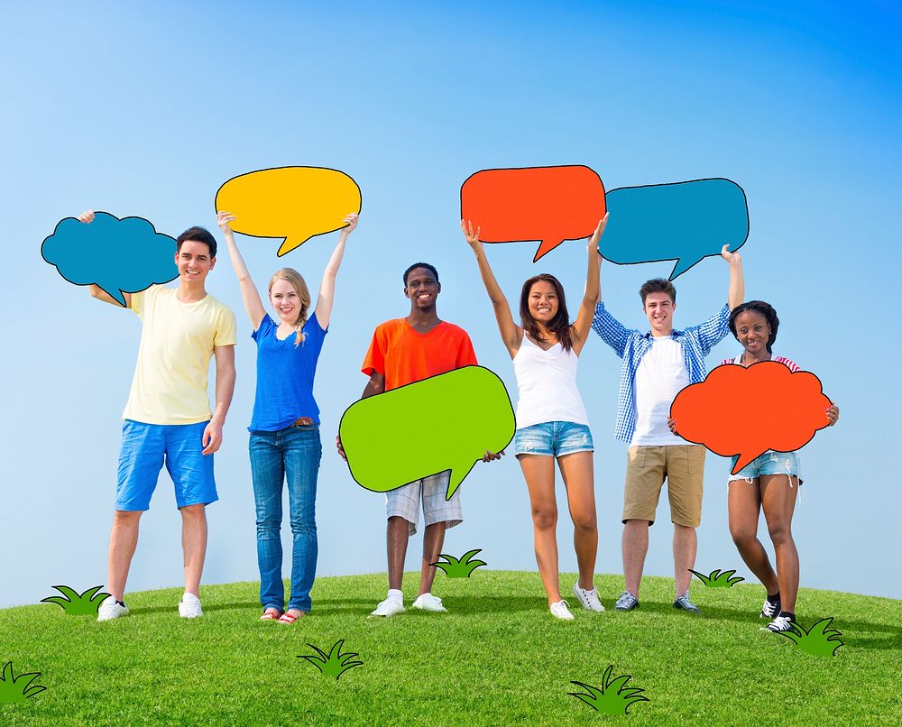 Group of People Holding Colorful Speech Bubbles Outdoors