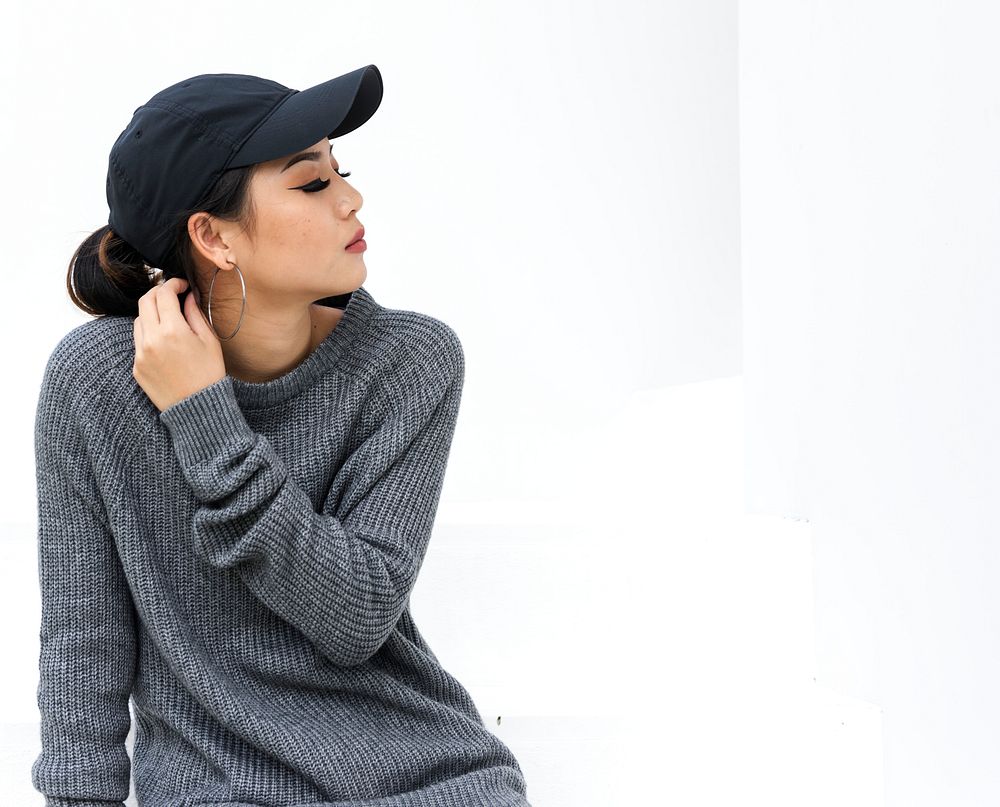 Closeup of asian woman wearing a cap