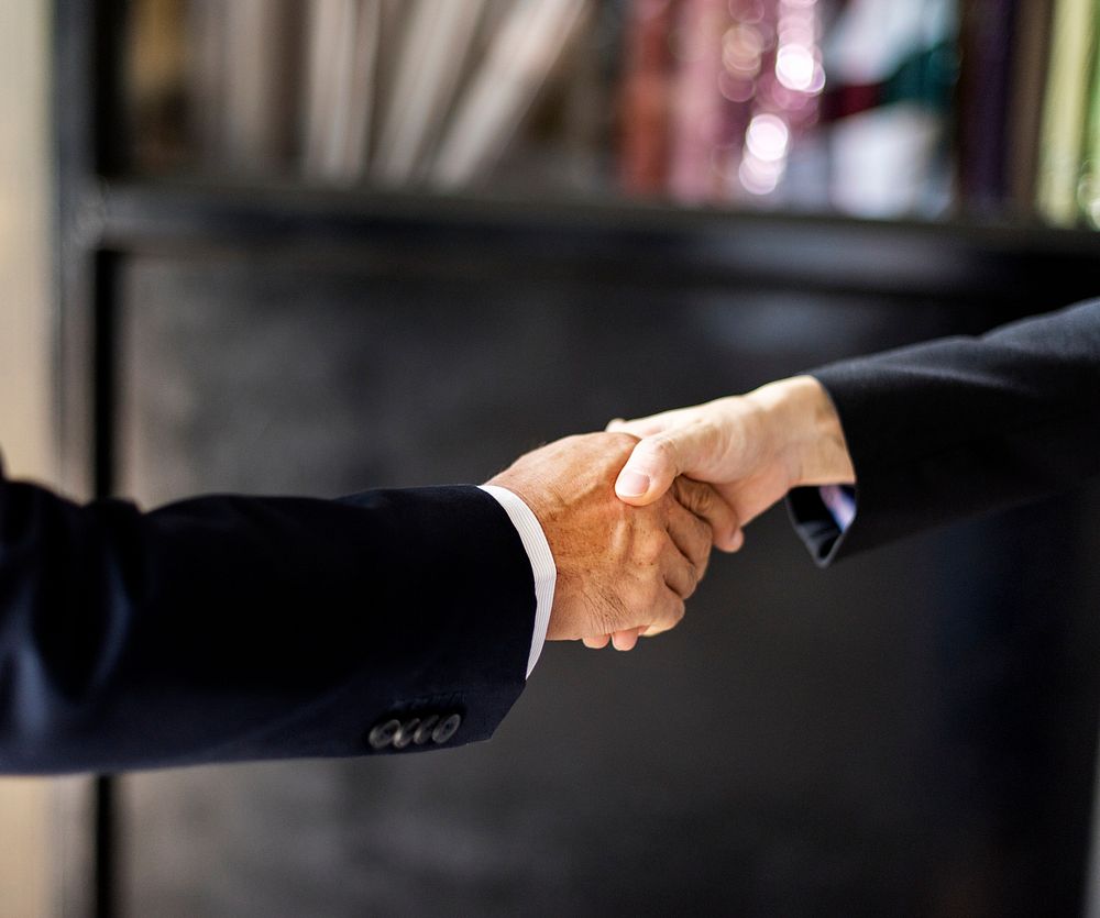 Close up of business people handshake 