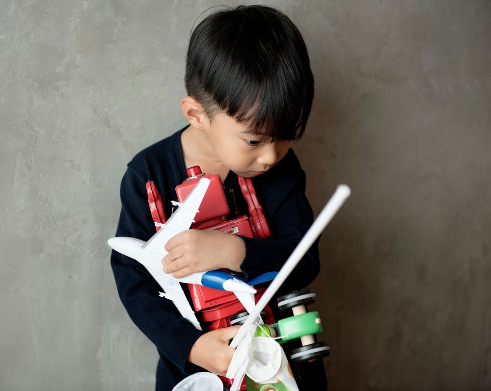 Young asian boy innocence adorable playing toy
