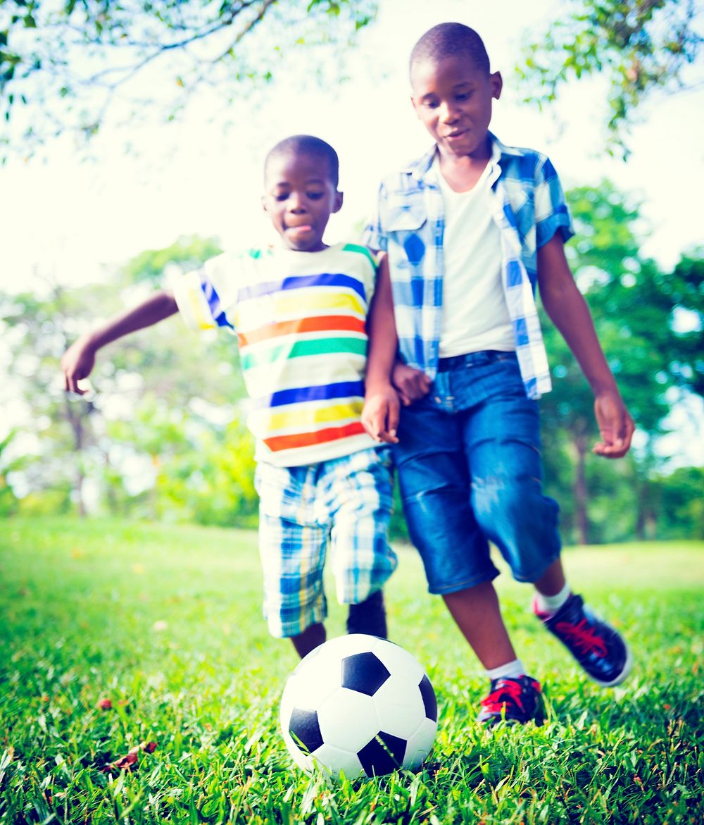 African Children Playing Exercise Football Concept