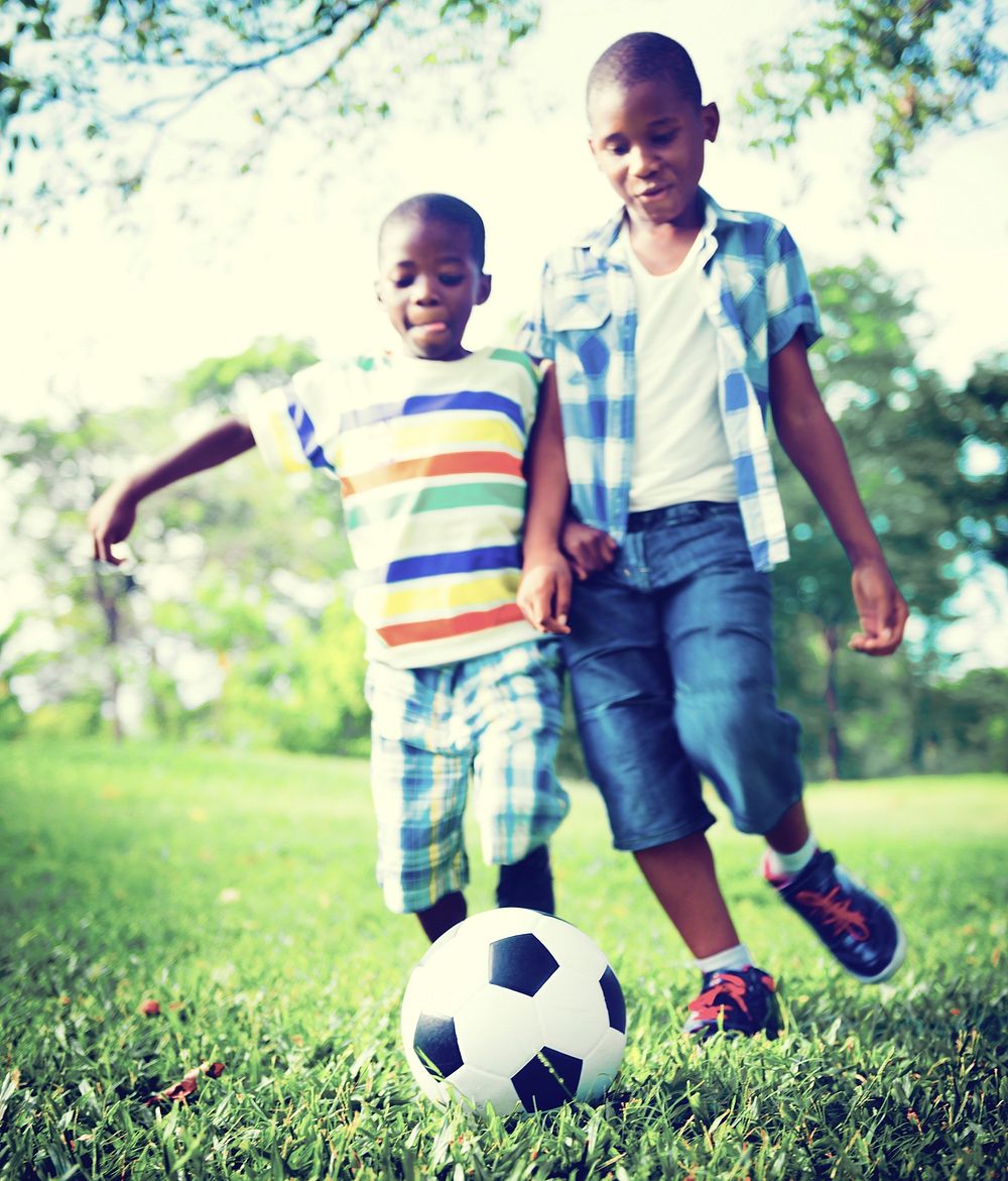 African Children Playing Exercise Football Concept