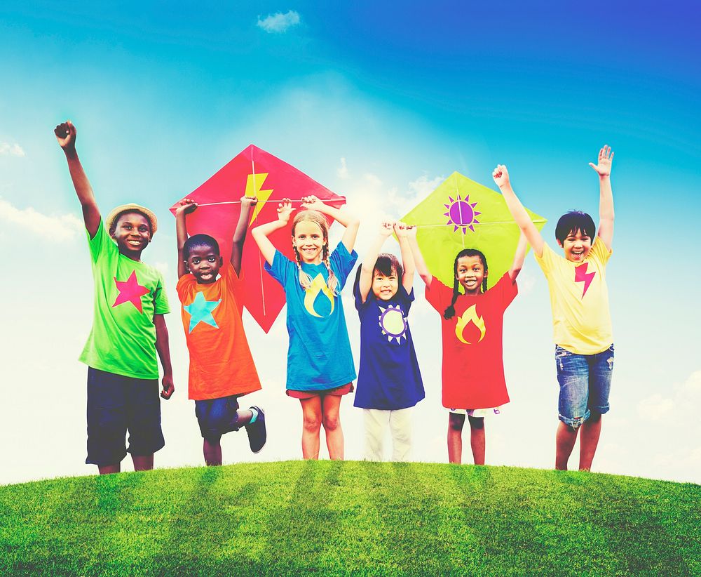 Group of Children Playing Kites Outdoors Concept