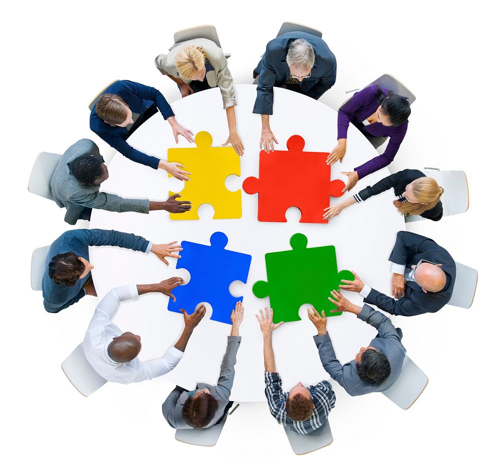 Business People with Jigsaw Puzzle and Teamwork Concept