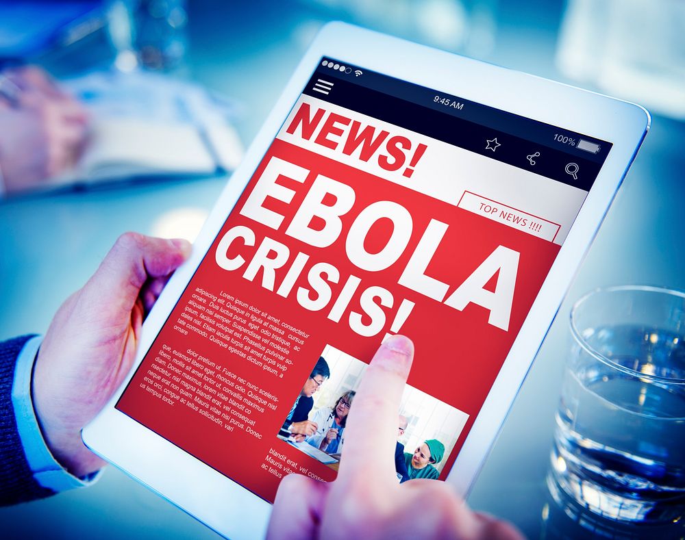 Businessman Holding Tablet Ebola News Concept