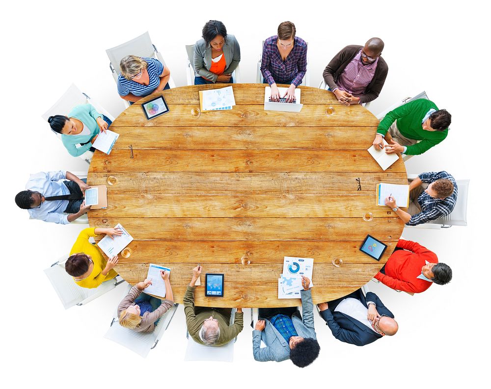 Diverse People Working Around the Conference Table