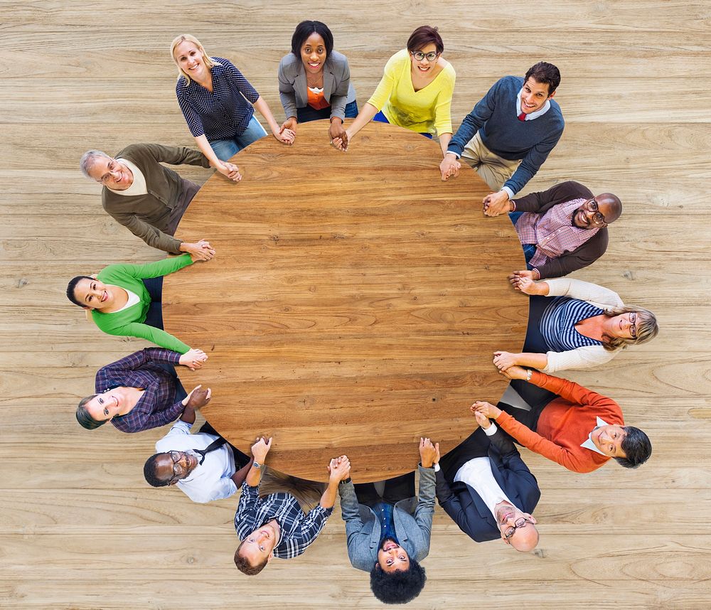 Diverse Multiethnic People Holding Hands Indoors