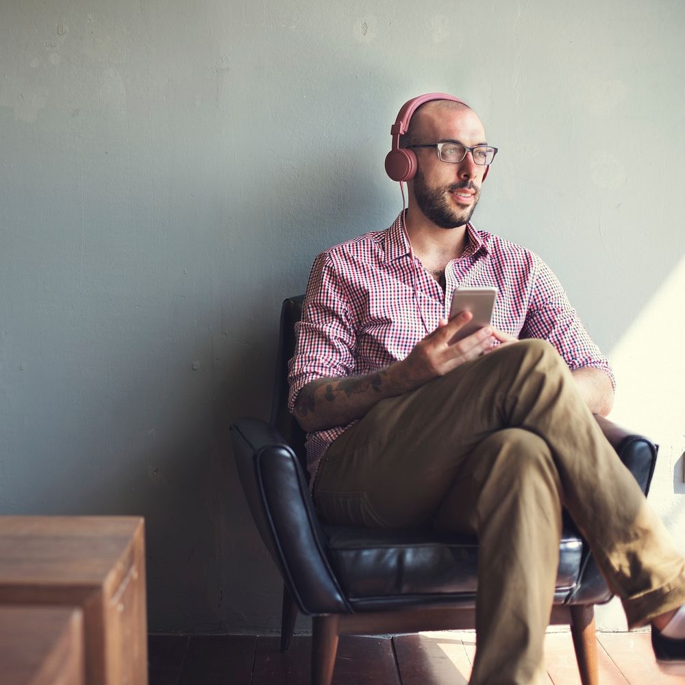 Man Sitting Technology Lifestyle Listening Concept