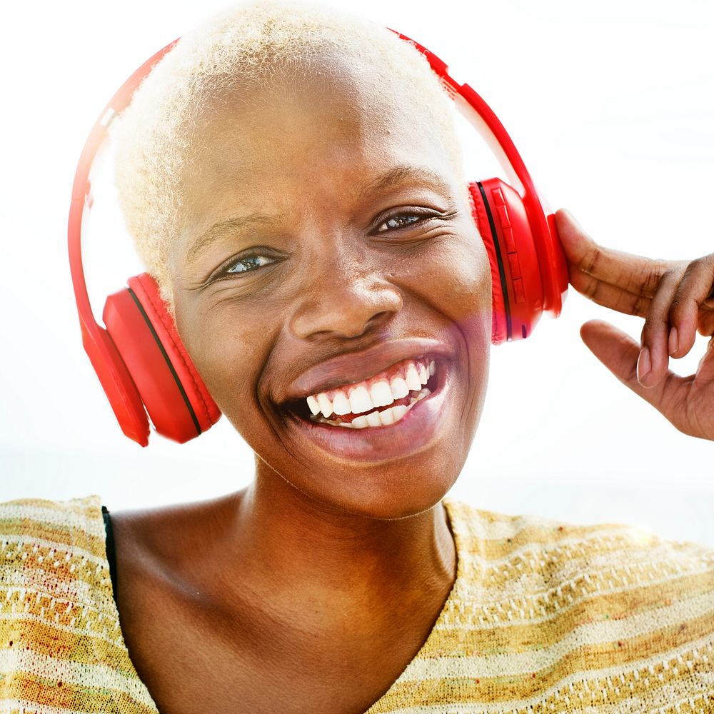 Cheerful woman listening to music on her headset