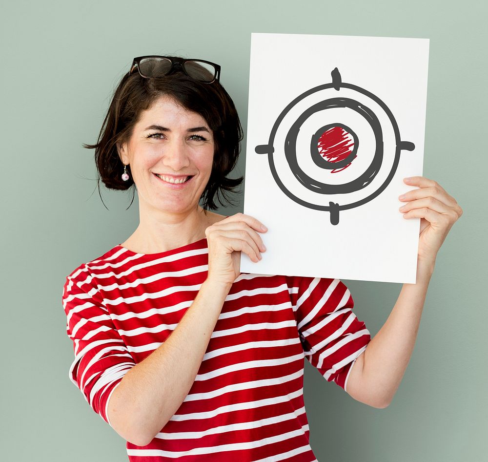 Woman holding placard with target aim icon