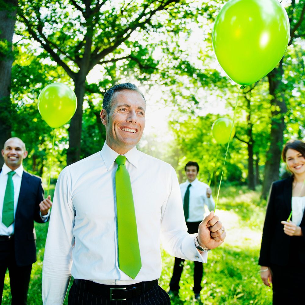 Eco-Friendly Business People Holding Green Balloons Concept