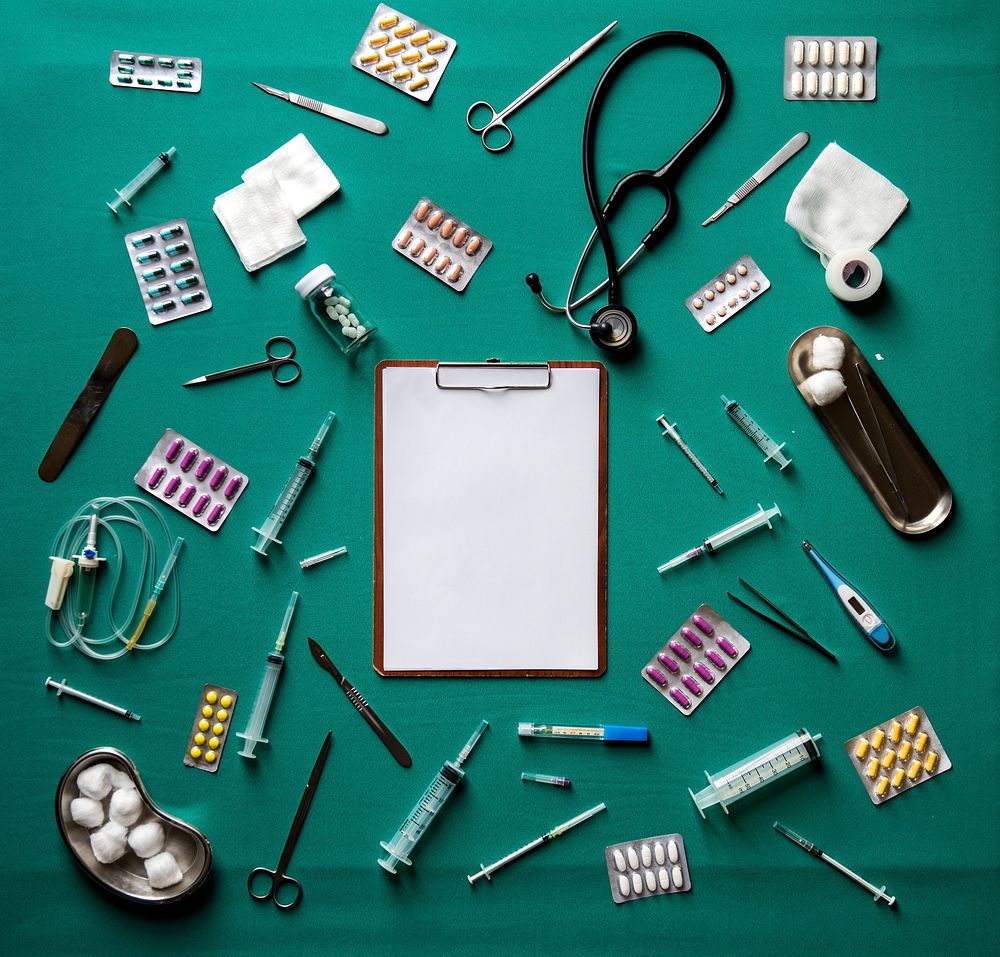 Blank clipboard paper on the table with medical stuff