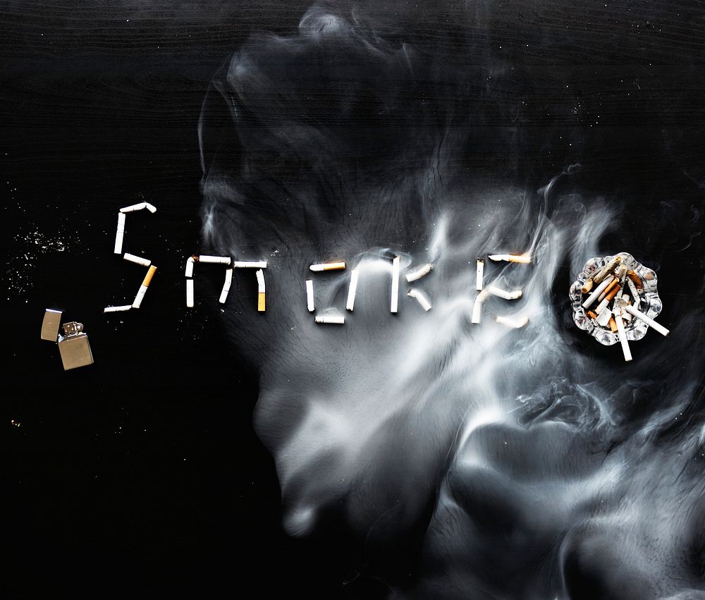 Cigarette butts spelling the word smoke