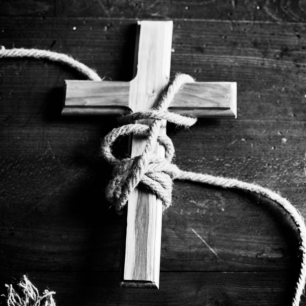 Wooden cross wrapped with a rope