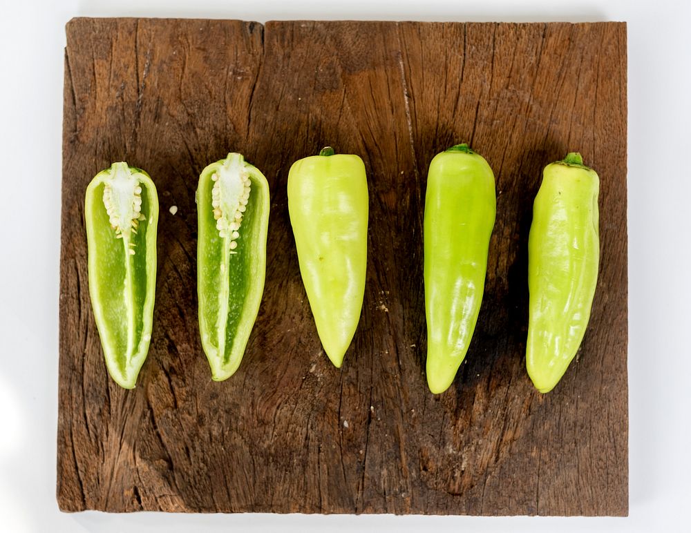 Chopped fresh green chili on a wooden plate