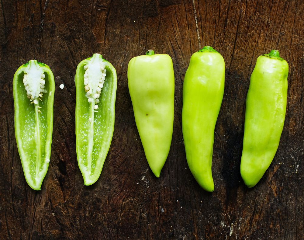 Aerial view of fresh jalapeno pepper on wooden background