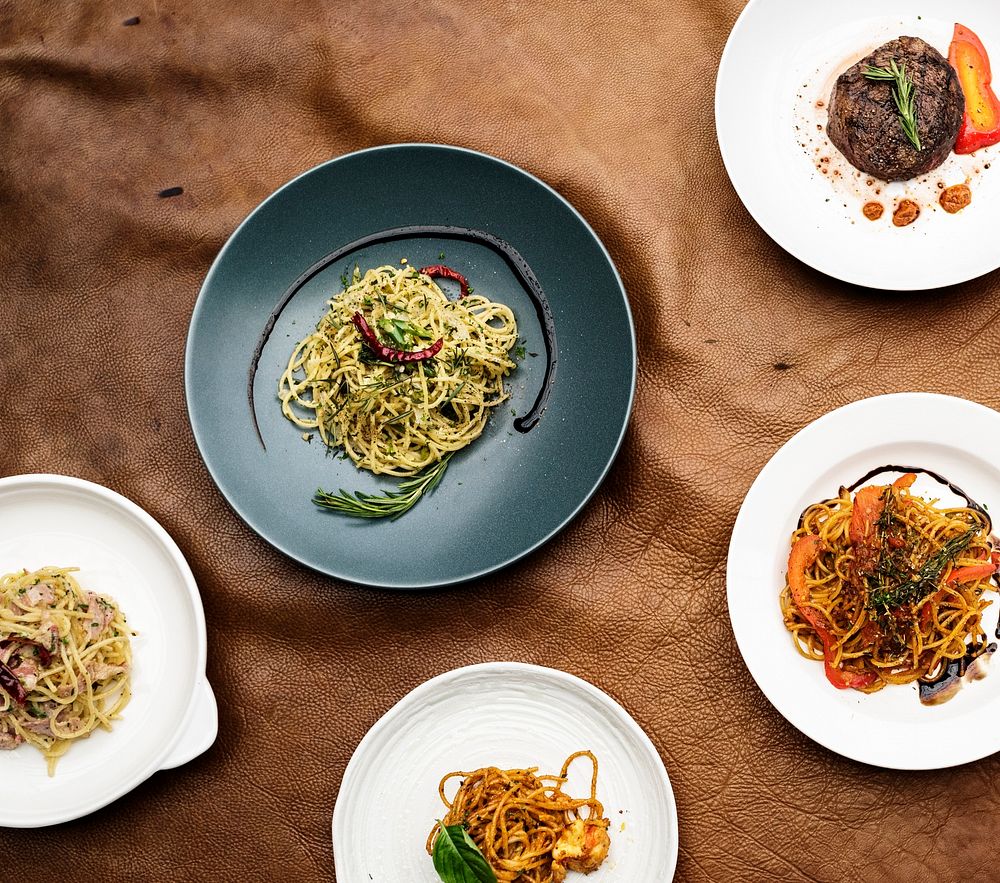 Mixed italian food plates on table