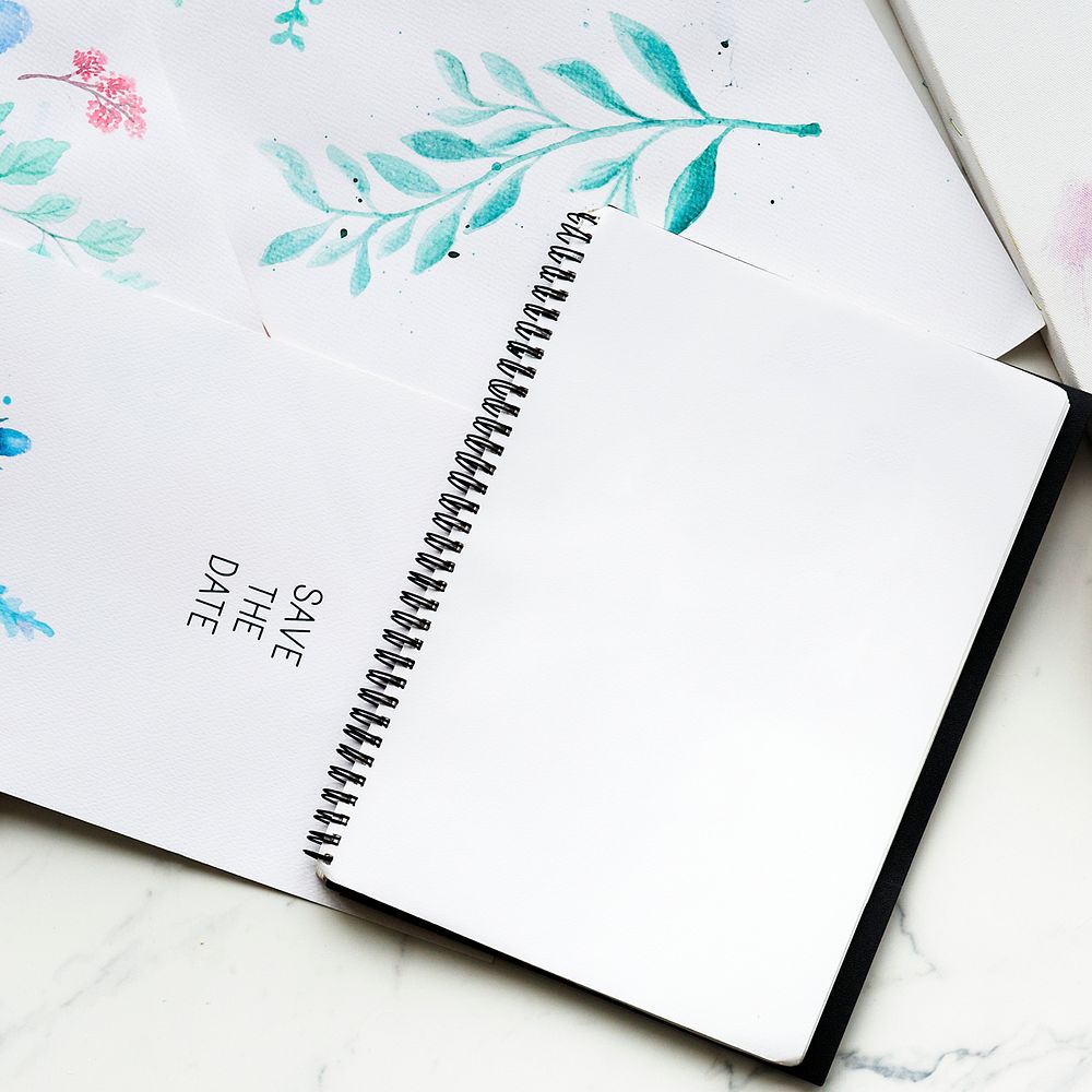 Blank copy-space notepad and drawing of foliage