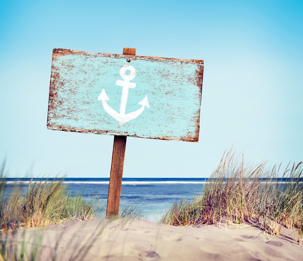 Blue Painted Wood Label on Beach