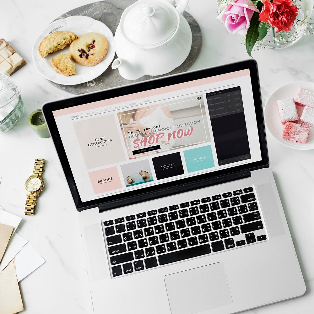 Laptop Online Shopping Teapot Cookies Flower Decor Concept