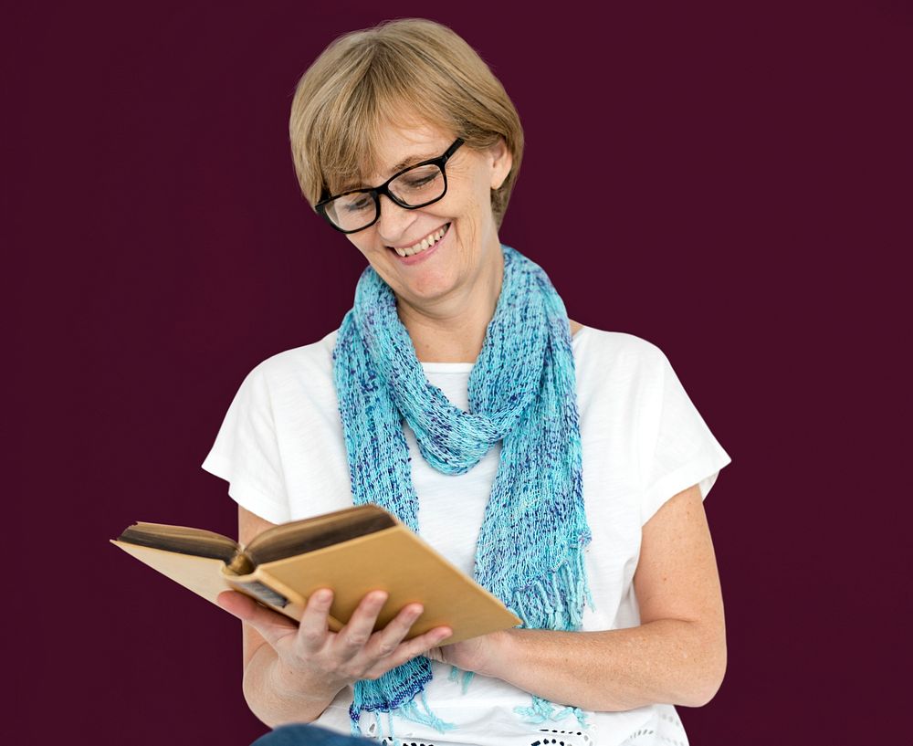 Mature Caucasian Woman Smiling Holding Notebook