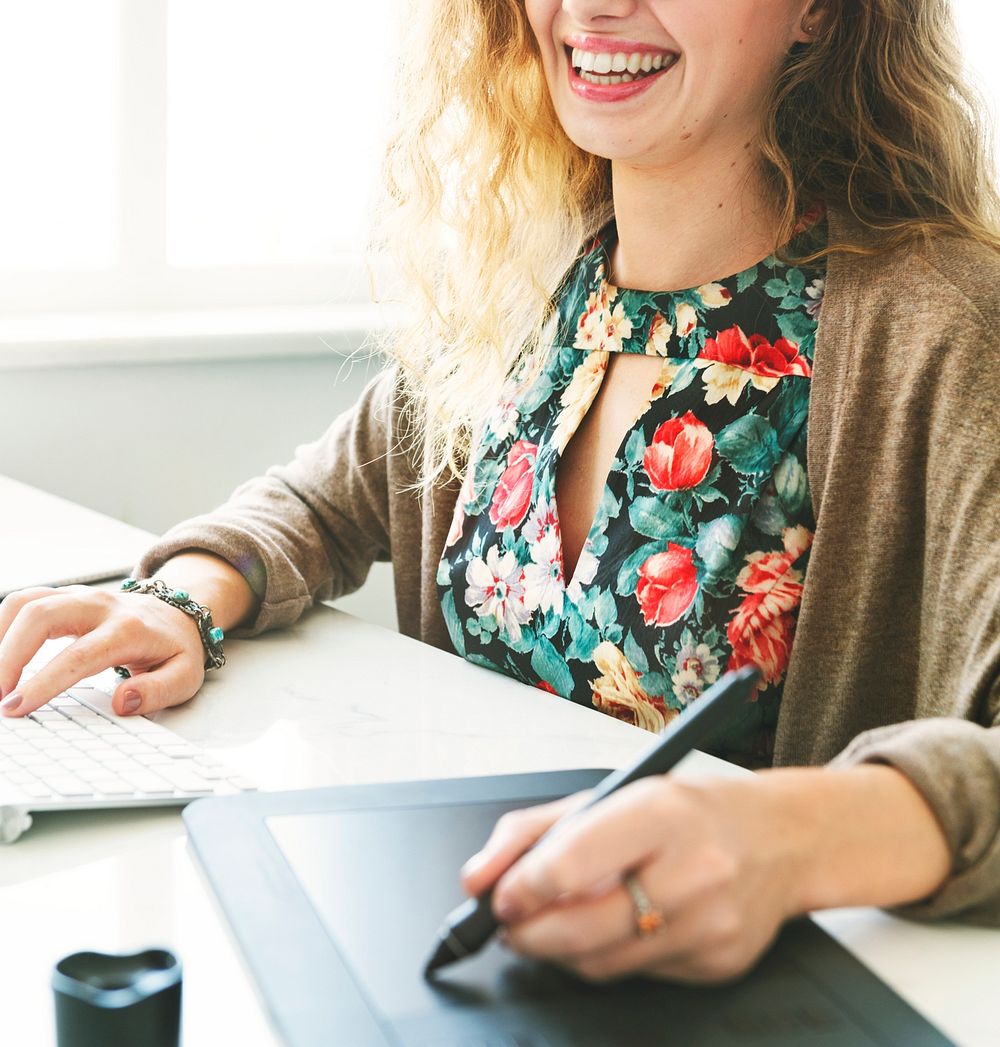 Female Smiling Mousepad Keyboard Workspace Concept