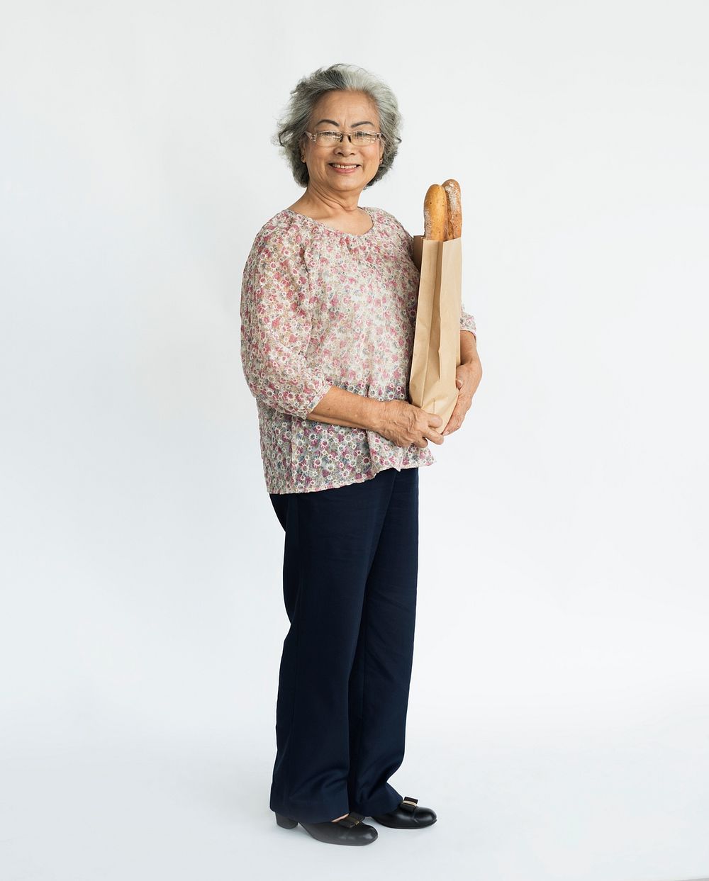 Old lady carrying bread shopping bag