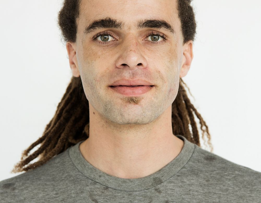 Guy with dreadlocks serious expression portrait