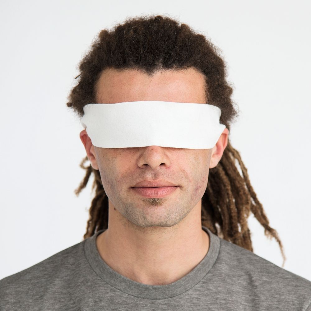 Guy blindfolded isolated studio portrait