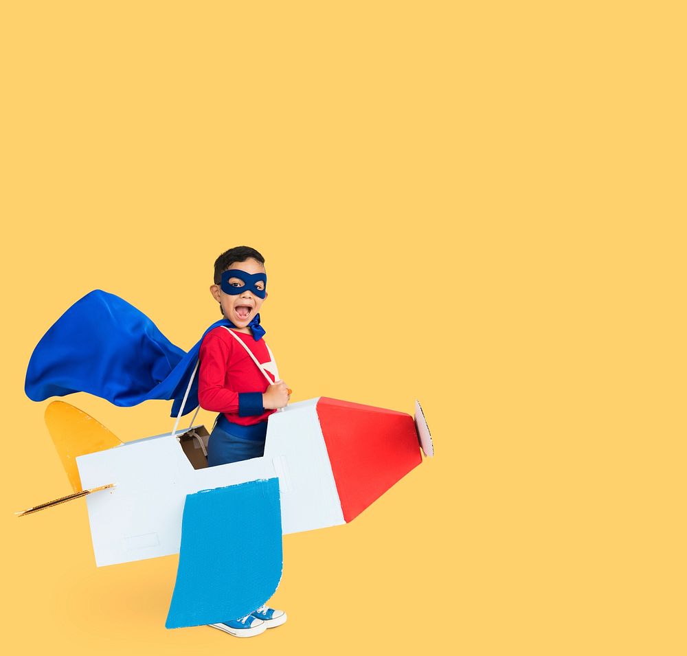 Superhero Boy Smiling Playing Cardboard Airplane Portrait