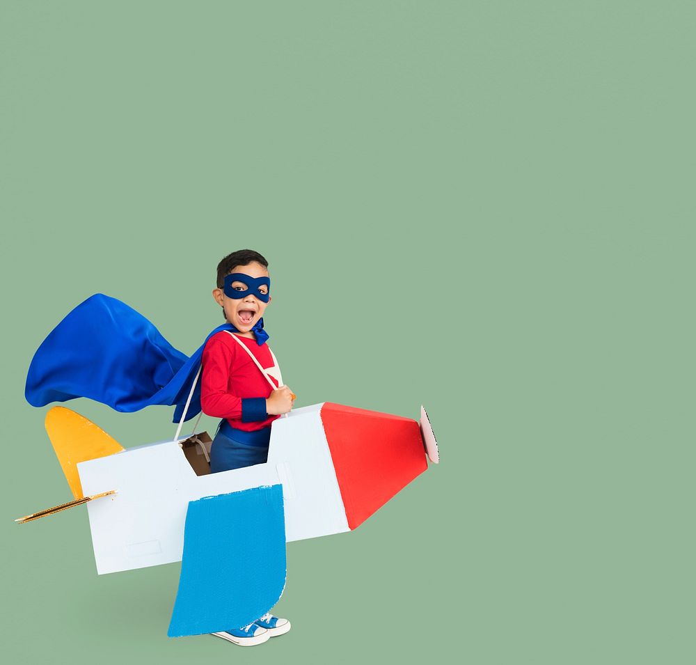 Superhero Boy Smiling Playing Cardboard Airplane Portrait