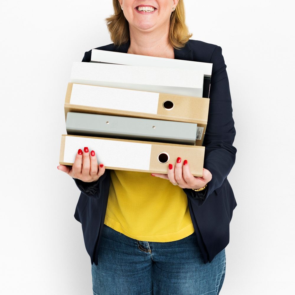 Woman holding a bunch of folders