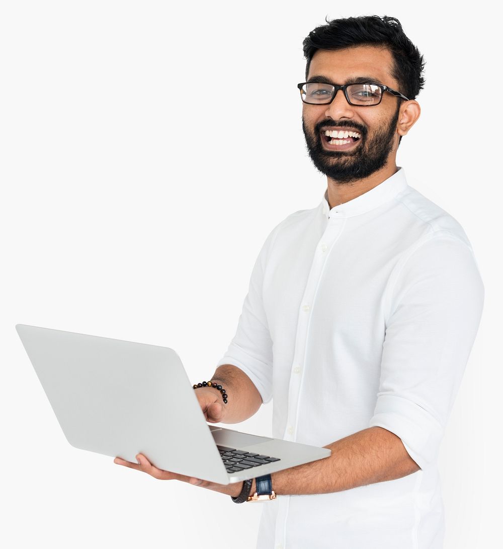 Smiling Indian guy with a computer