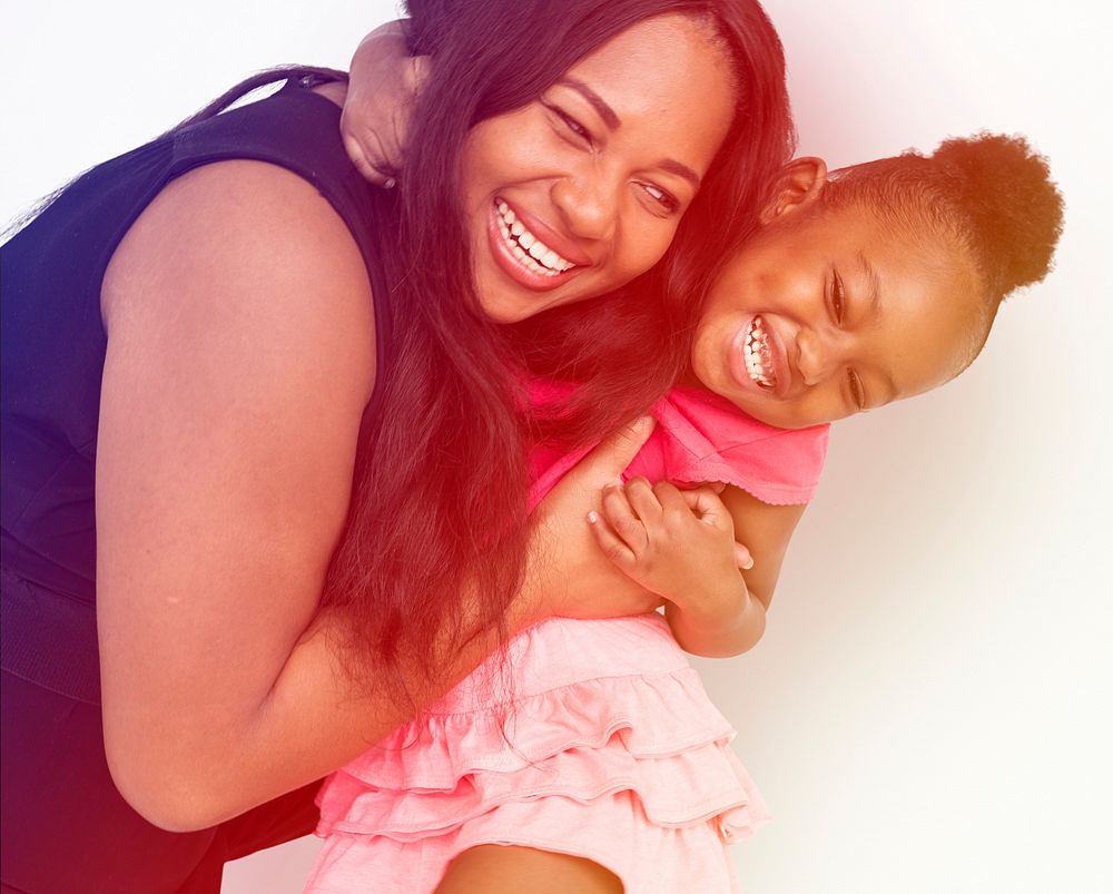 African American Mother Daughter Hug Together Studio Portrait