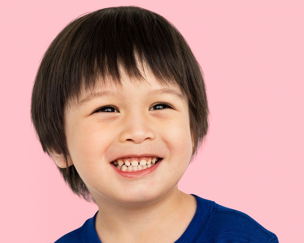 Happy little Asian boy, smiling face portrait psd