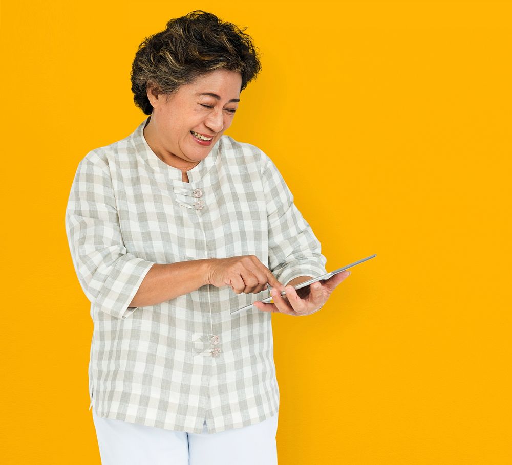 Mature Woman Holding Tablet Concept
