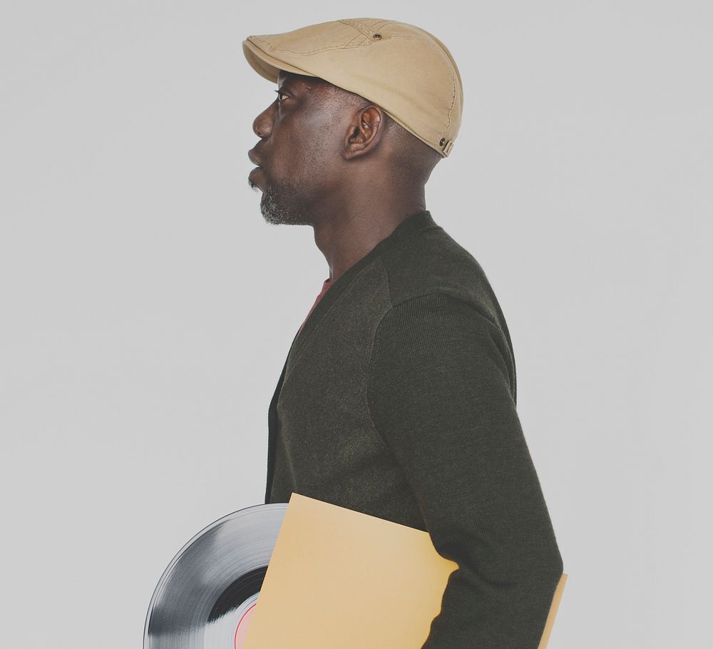 African Male Holding Vinyl Record Concept