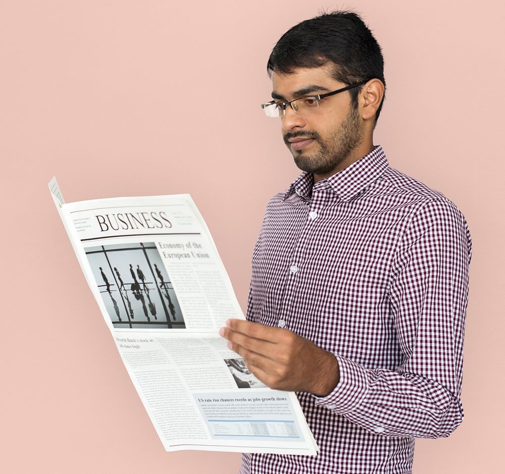 Indian Man Reading Newspaper Concept