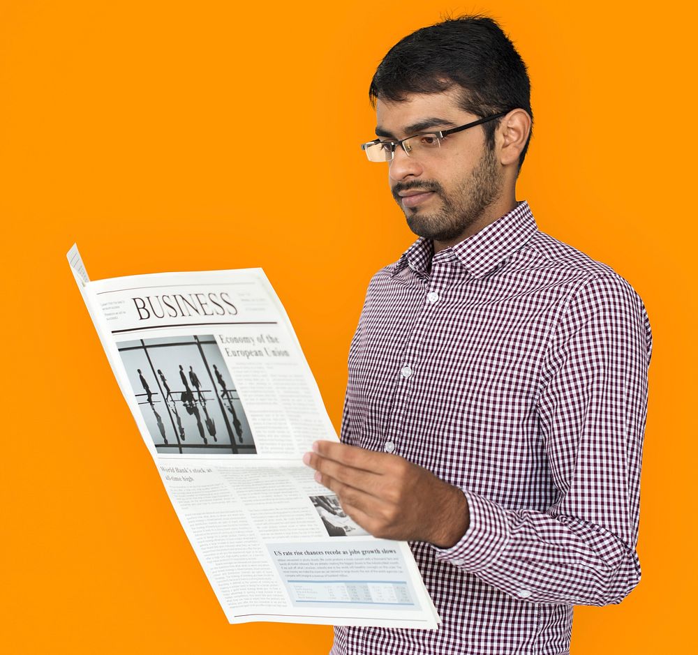 Indian Man Reading Newspaper Concept