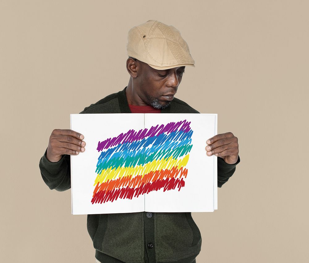 African man holding placard with LGBT icon sign