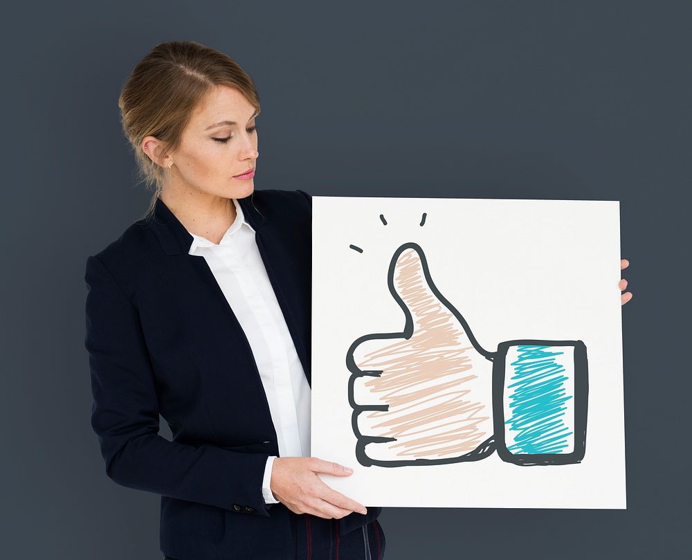 Businesswoman holding placard with agreement social media icon