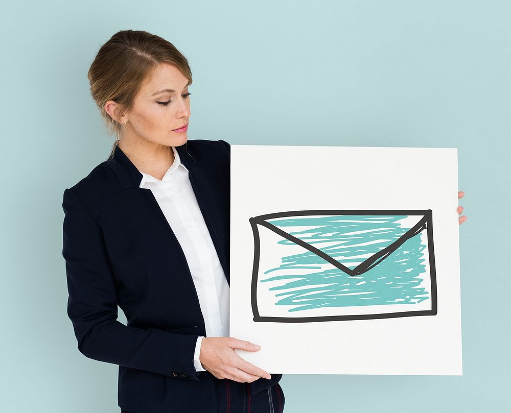 Businesswoman holding placard with email icon