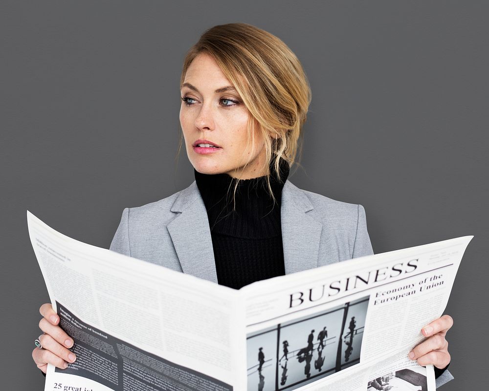 Caucasian Business Woman Reading Newspaper